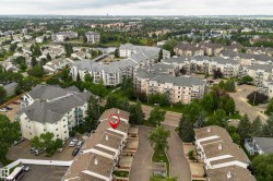 Aerial view of a residential community featuring townhomes and multi-story apartment buildings - 