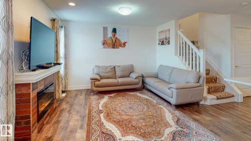 6859 Evans Wynd, Edmonton, AB - Indoor Photo Showing Living Room With Fireplace