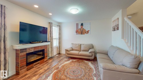 6859 Evans Wynd, Edmonton, AB - Indoor Photo Showing Living Room With Fireplace
