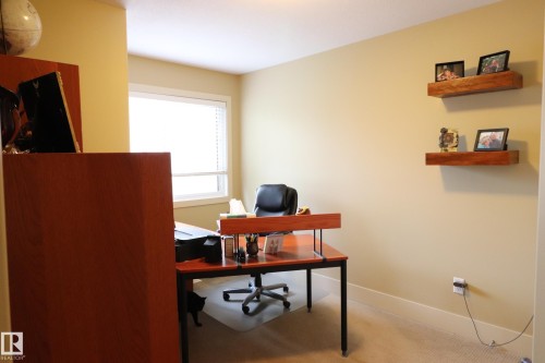 Well-lit room with neutral-toned walls and carpet flooring - 7492 May Common, Edmonton, AB 