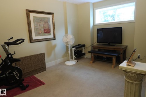 Recessed window framing light-toned walls with carpeted flooring - 7492 May Common, Edmonton, AB 