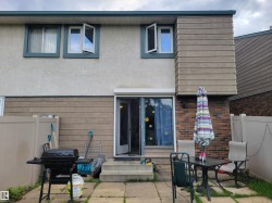 Rear patio area featuring concrete paver flooring - 