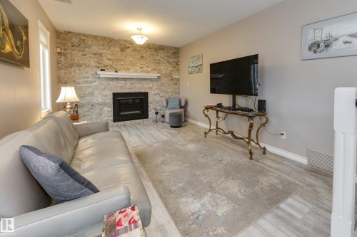 4335 47 Street, Edmonton, AB - Indoor Photo Showing Living Room With Fireplace