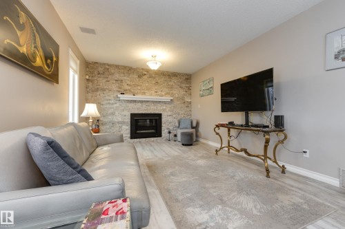 4335 47 Street, Edmonton, AB - Indoor Photo Showing Living Room With Fireplace