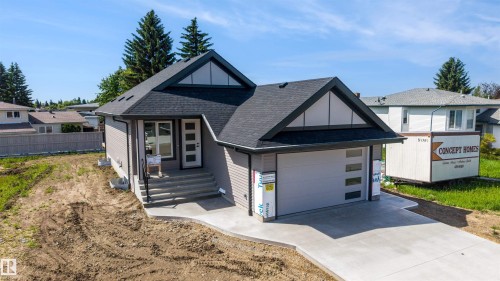 Contemporary ranch-style home featuring gray horizontal siding and a dark shingle roof - 39 Elsinore Place, Edmonton, AB 