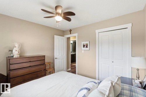 Neutral wall paint, white trim, and a ceiling fan with integrated lighting - 4007 45 Street, Stony Plain, AB 