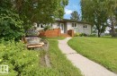 Residence featuring light gray siding, white trim, and a white entry door - 4007 45 Street, Stony Plain, AB 