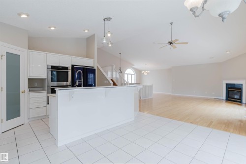 1641 Forbes Way, Edmonton, AB - Indoor Photo Showing Kitchen With Fireplace