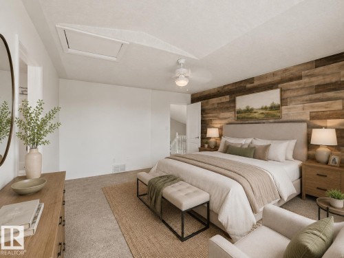 Carpeted bedroom featuring a wood-panel accent wall, a ceiling fan with integrated lighting, and a sloped ceiling with an attic access panel - 1619 Welbourn Cove, Edmonton, AB 