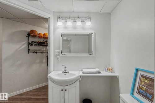 Vanity area featuring a white pedestal sink with cabinet storage - 1619 Welbourn Cove, Edmonton, AB 