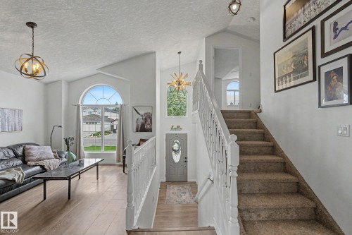 Vaulted ceilings with contemporary lighting fixtures - 1619 Welbourn Cove, Edmonton, AB 