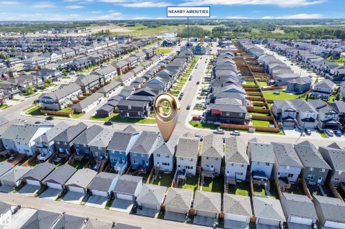 Aerial perspective of a residential community featuring numerous single-family homes with private backyards and attached garages - 2246 54 Street, Edmonton, AB 