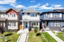 Two-story residence featuring light gray siding, dark gray shingle roofing, and stone veneer accents - 2246 54 Street, Edmonton, AB 