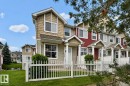 Two-story townhome with tan siding and shake accents - 126 2051 Towne Centre Boulevard, Edmonton, AB 