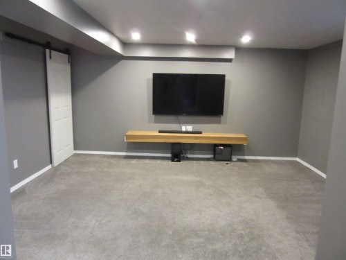Spacious room featuring gray carpet flooring and recessed ceiling lighting - 64 Heatherglen Close, Spruce Grove, AB 