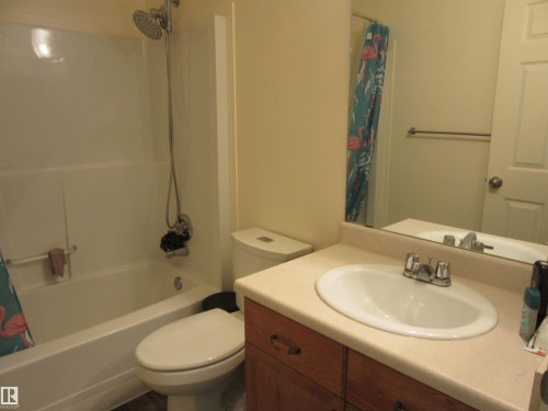 Bathroom featuring a white bathtub and shower combination with a handheld showerhead - 64 Heatherglen Close, Spruce Grove, AB 