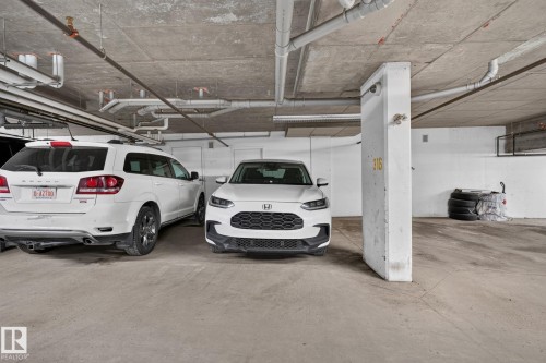 Concrete parking garage space featuring a visible parking spot number 316 - 415 111 Watt Common, Edmonton, AB 