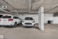 Concrete parking garage space featuring a visible parking spot number 316 - 