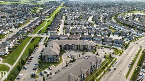 Aerial perspective showcasing a residential development with varied housing styles - 415 111 Watt Common, Edmonton, AB 