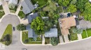 Residential property with a brown shingle roof and mature trees - 4712 131 Avenue Nw, Edmonton, AB 