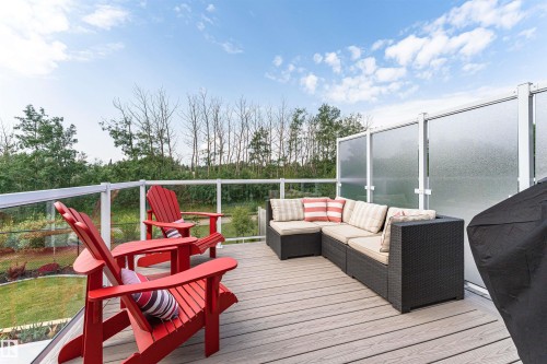 Expansive outdoor deck featuring wood-finish flooring - 102 Horton Way, Ardrossan, AB 
