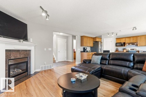 27 Spruce Ridge Drive, Spruce Grove, AB - Indoor Photo Showing Living Room With Fireplace