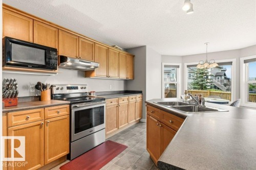 27 Spruce Ridge Drive, Spruce Grove, AB - Indoor Photo Showing Kitchen With Double Sink