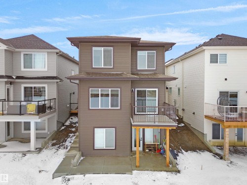 Multi-level property exterior with brown horizontal siding - 19066 20A Avenue, Edmonton, AB 
