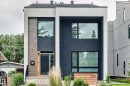 Modern façade featuring dark stucco and light-colored trim - 12631 52 Avenue, Edmonton, AB 