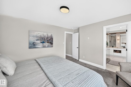 Bedroom featuring light gray wall paint and dark gray carpeting - 12631 52 Avenue, Edmonton, AB 