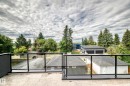 Rooftop deck featuring glass railings and a textured surface - 12631 52 Avenue, Edmonton, AB 