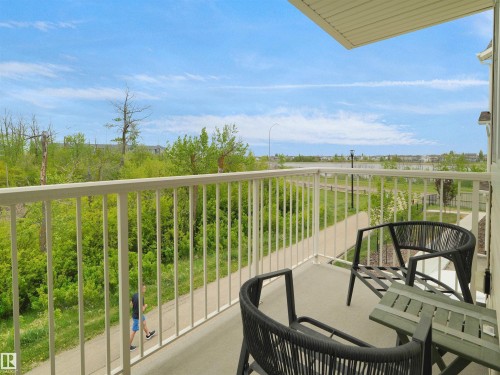 Private balcony with a concrete floor and white metal railings - 49 17832 78 Street, Edmonton, AB 