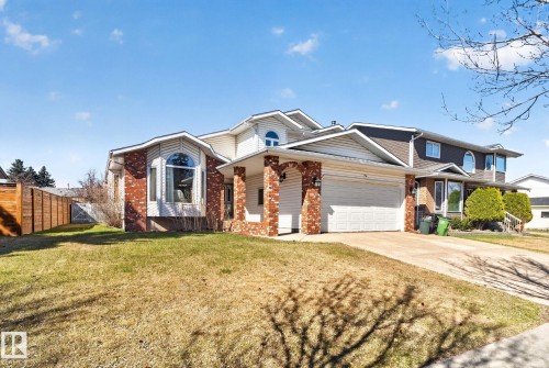 Brick and siding exterior featuring a prominent bay window - 5612 Mcleod Road, Edmonton, AB 