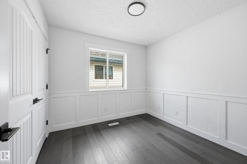 Dark wood-finish flooring complements the crisp white walls - 631 Jenner Cove Cove, Edmonton, AB 