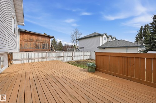 Expansive outdoor wood deck with a built-in privacy wall - 631 Jenner Cove Cove, Edmonton, AB 