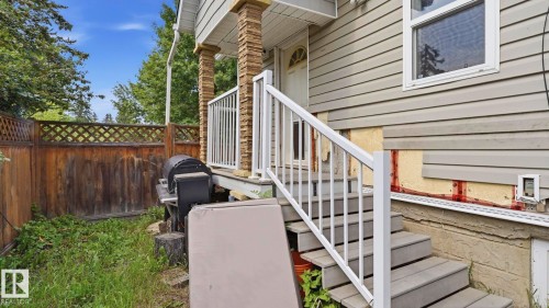 Exterior stairs featuring white railings - 10115 104 Street, Westlock, AB 
