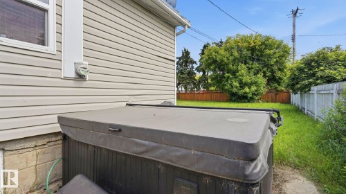 Exterior vinyl siding with a single window and a concrete foundation - 10115 104 Street, Westlock, AB 