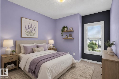 Carpeted bedroom featuring a window with white blinds, floating wall shelves, and an accent wall - 24 655 Watt Boulevard, Edmonton, AB 