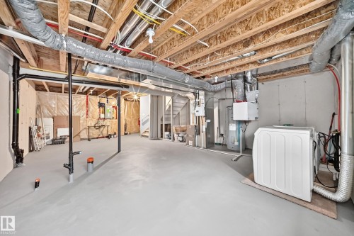 Unfinished basement featuring exposed wood joists, concrete flooring, and visible utility systems - 69 Tonewood Boulevard, Spruce Grove, AB - Indoor Photo Showing Basement