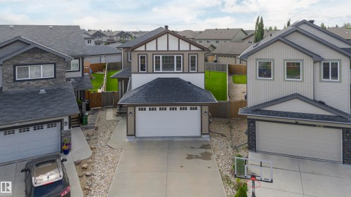 Modern two-story residence with a two-car garage, featuring a white garage door - 1235 164 Street, Edmonton, AB 