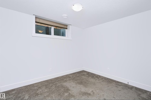 White walls with crisp baseboards, recessed lighting, and a neutral carpet - 1235 164 Street, Edmonton, AB 