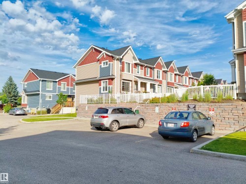 Row of multi-story residences featuring pitched roofs and varied siding textures - 23 1508 105 Street, Edmonton, AB 