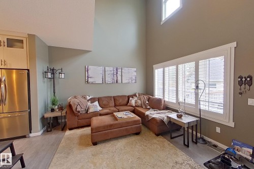 Vaulted ceilings and abundant natural light from multiple windows - 14412 98 Street, Edmonton, AB - Indoor Photo Showing Living Room