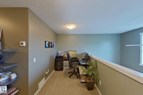 Dedicated loft area with wood-finish flooring - 14412 98 Street, Edmonton, AB - Indoor Photo Showing Office