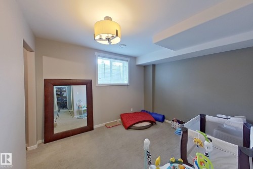 Recessed window with blinds, overhead lighting, neutral wall colors, and carpeted flooring - 14412 98 Street, Edmonton, AB - Indoor