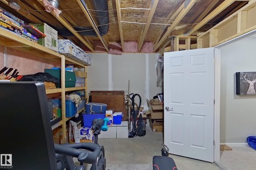 Unfinished basement area featuring exposed ceiling joists and ductwork, providing renovation potential - 14412 98 Street, Edmonton, AB - Indoor Photo Showing Other Room