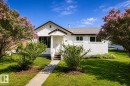 White stucco exterior with a gabled roofline and an asphalt shingle roof - 5218 52 Ave, St. Paul Town, AB  - Outdoor 