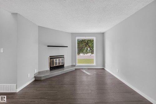 131 Cameron Crescent, Wetaskiwin, AB - Indoor Photo Showing Living Room With Fireplace