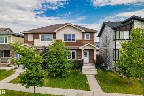 Contemporary multi-level residence featuring a brown and cream facade with white trim - 383 Charlesworth Drive, Edmonton, AB 