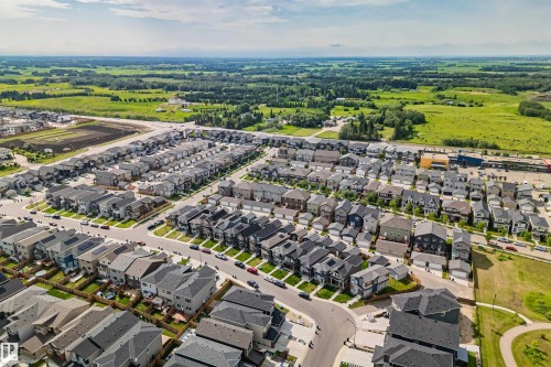 Residential neighborhood featuring a grid-pattern street layout, uniformly sized lots, and paved roadways - 383 Charlesworth Drive, Edmonton, AB 